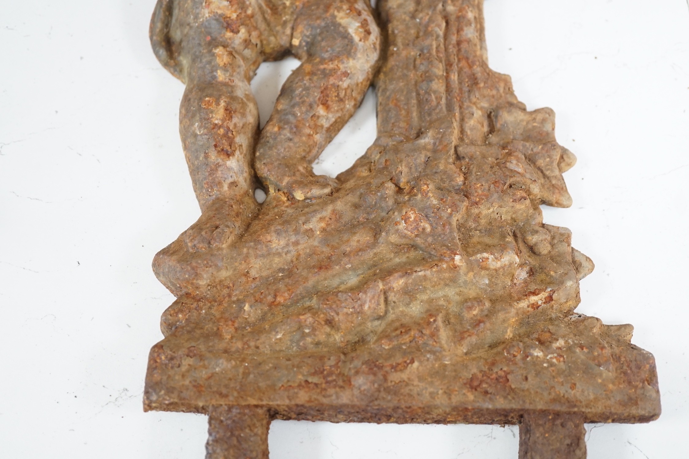 A cast iron putto mount. 50cm tall